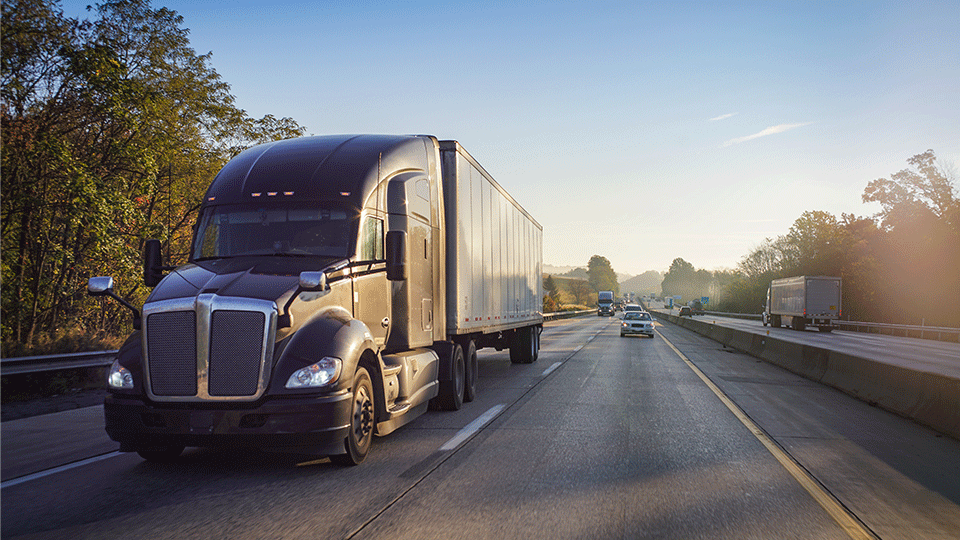 Black-Dry-Van-Semi-on-Highway